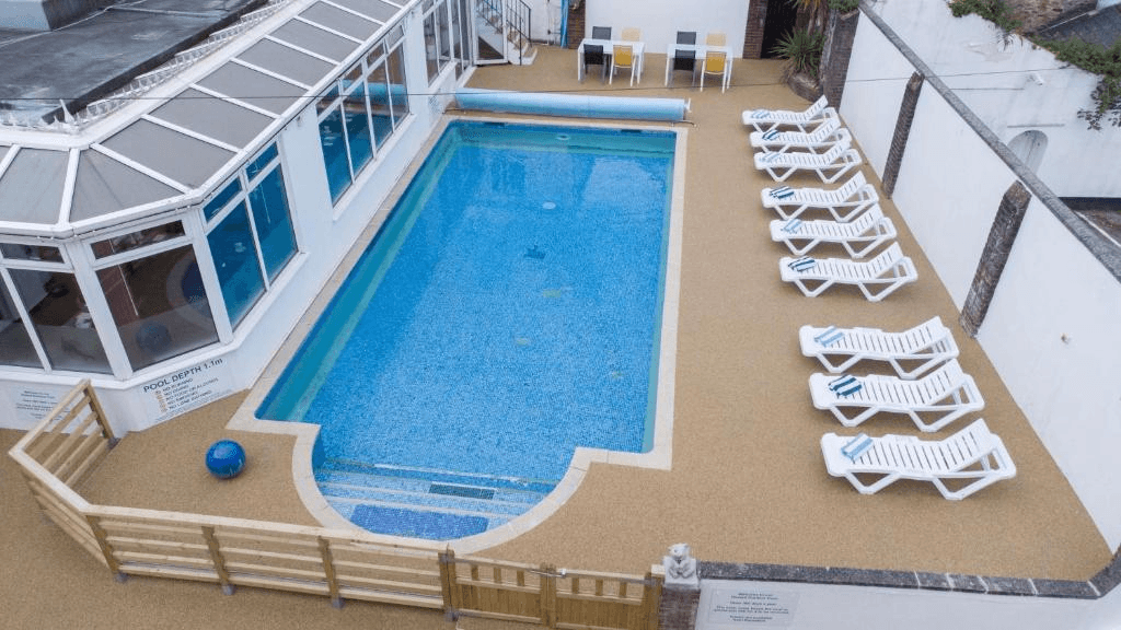 Pool deck with loungers at Best Western Fowey Valley